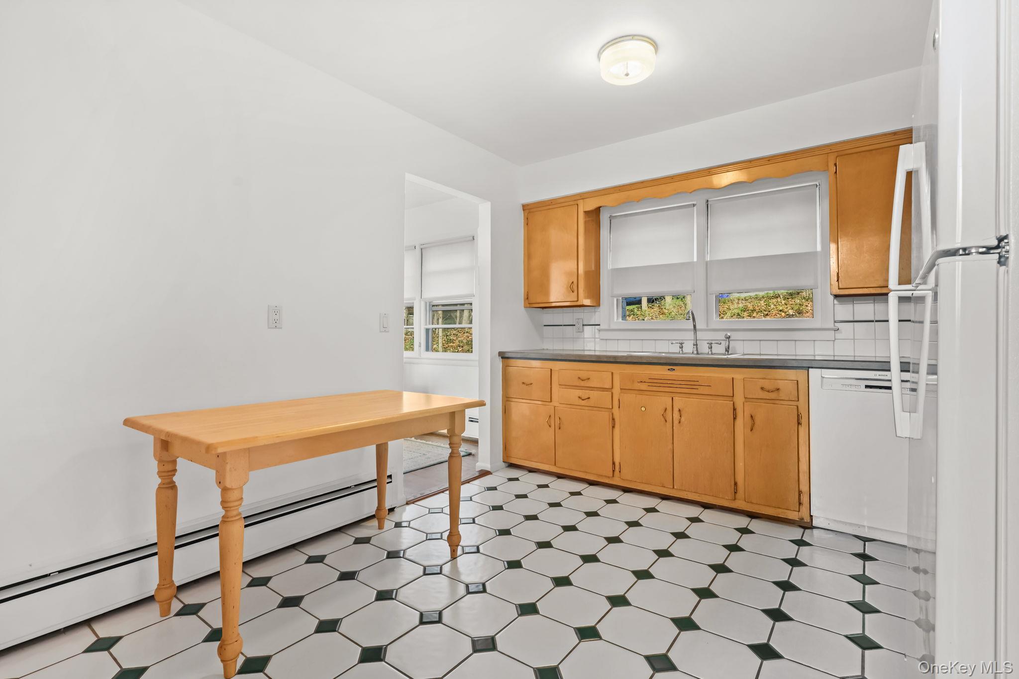 150 Rosedale Avenue White Plains, NY 10605 - Photo 12 of 42 a room with a table and a window