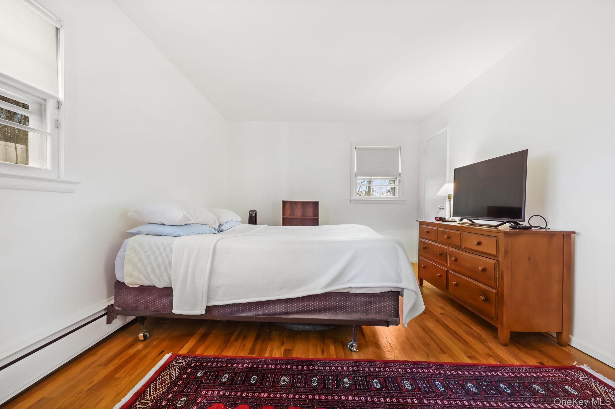 150 Rosedale Avenue White Plains, NY 10605 - Photo 16 of 42 a bedroom with a bed and flat screen tv