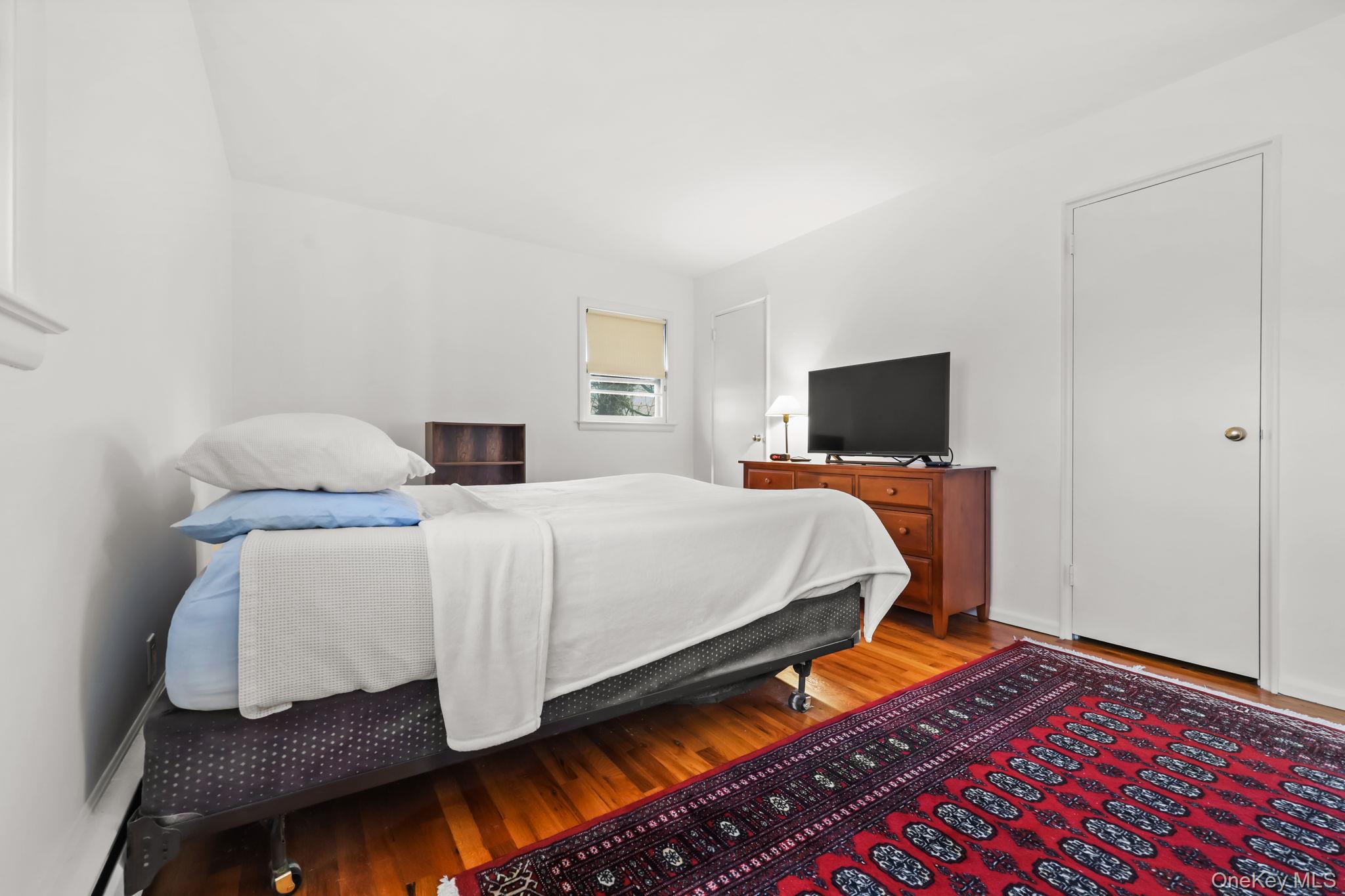 150 Rosedale Avenue White Plains, NY 10605 - Photo 17 of 42 a bedroom with a bed and flat screen tv