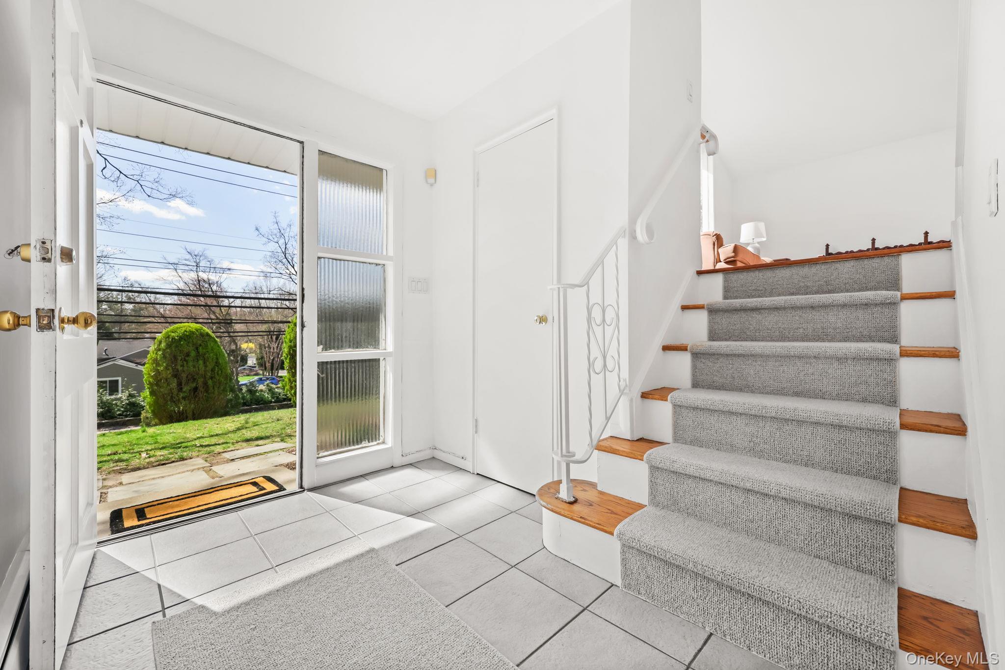 150 Rosedale Avenue White Plains, NY 10605 - Photo 2 of 42 a view of entryway with wooden floor and windows