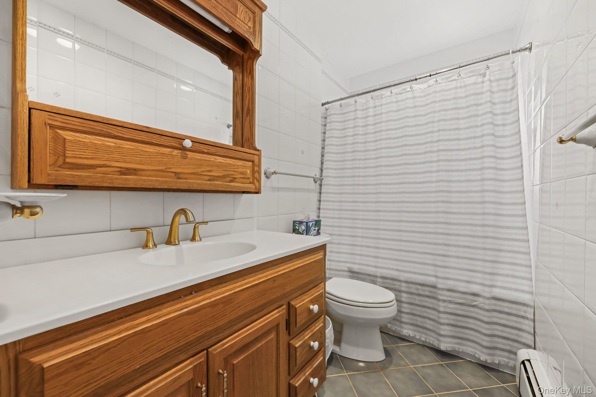 150 Rosedale Avenue White Plains, NY 10605 - Photo 24 of 42 a bathroom with a sink a toilet and shower