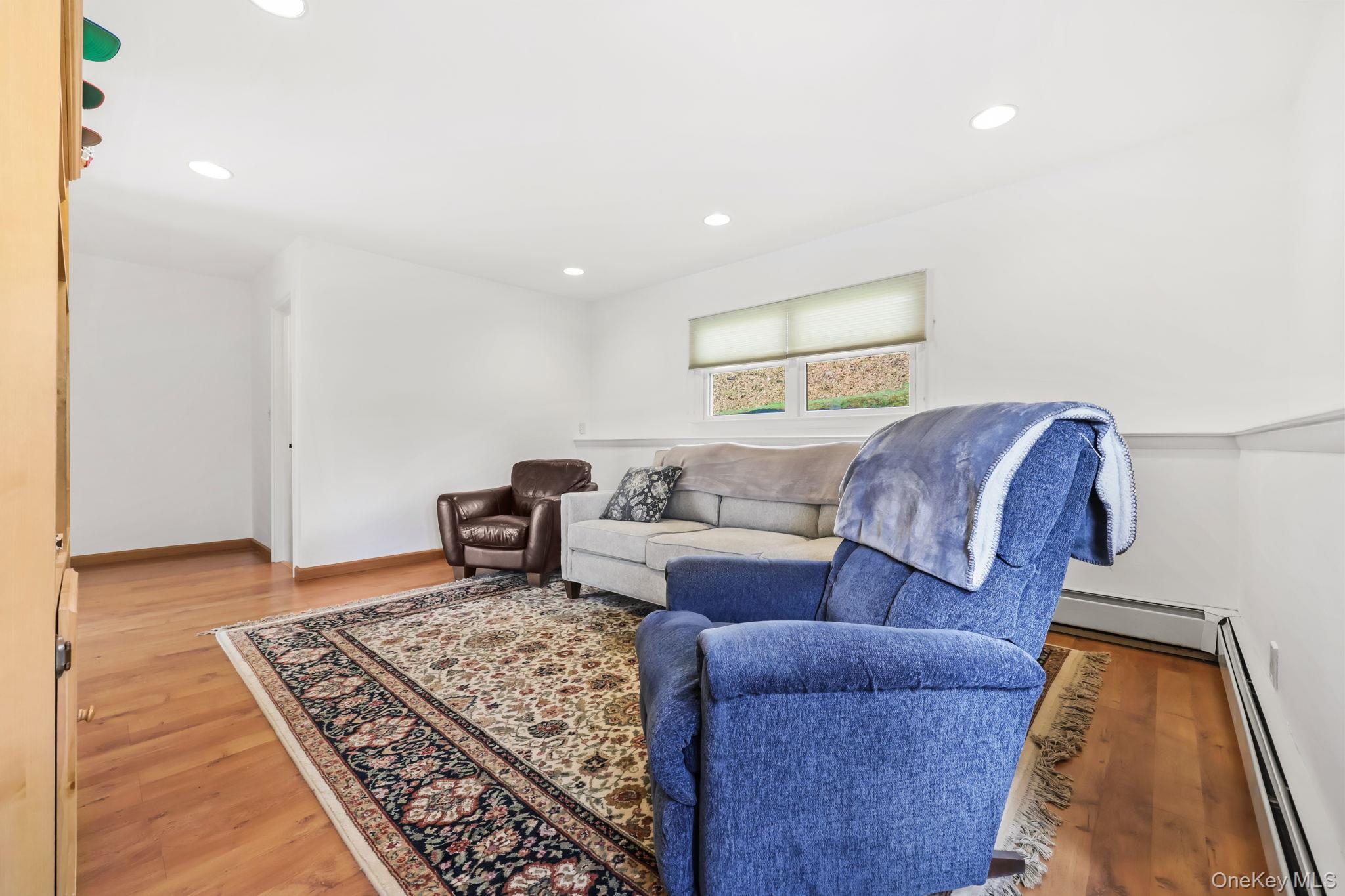 150 Rosedale Avenue White Plains, NY 10605 - Photo 27 of 42 a living room with furniture and a rug