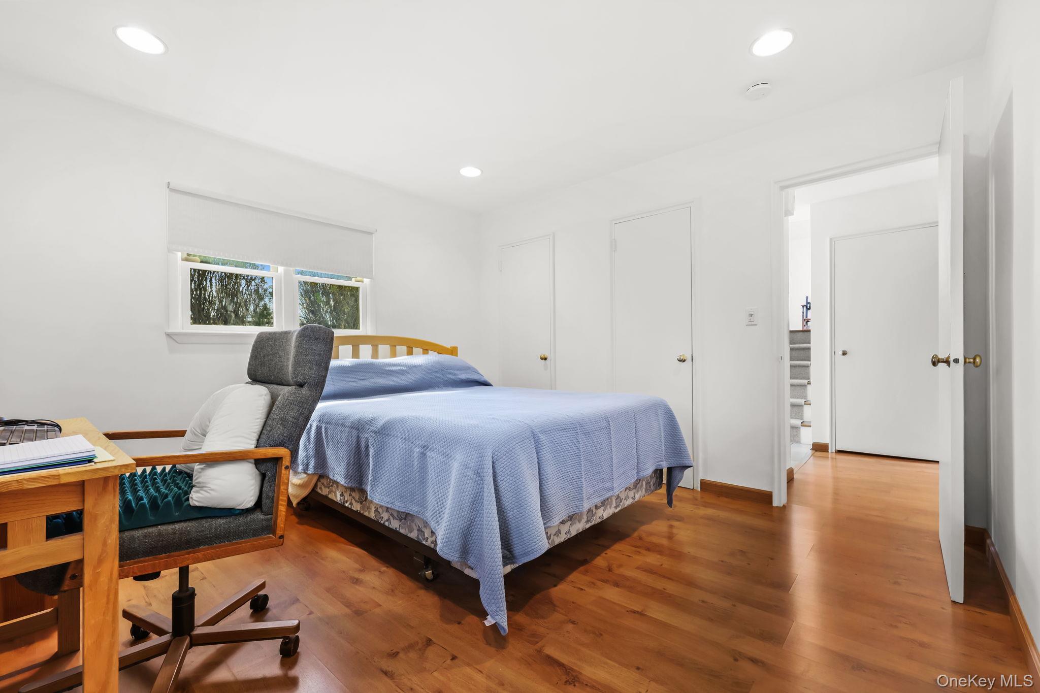 150 Rosedale Avenue White Plains, NY 10605 - Photo 29 of 42 a spacious bedroom with a bed and wooden floor
