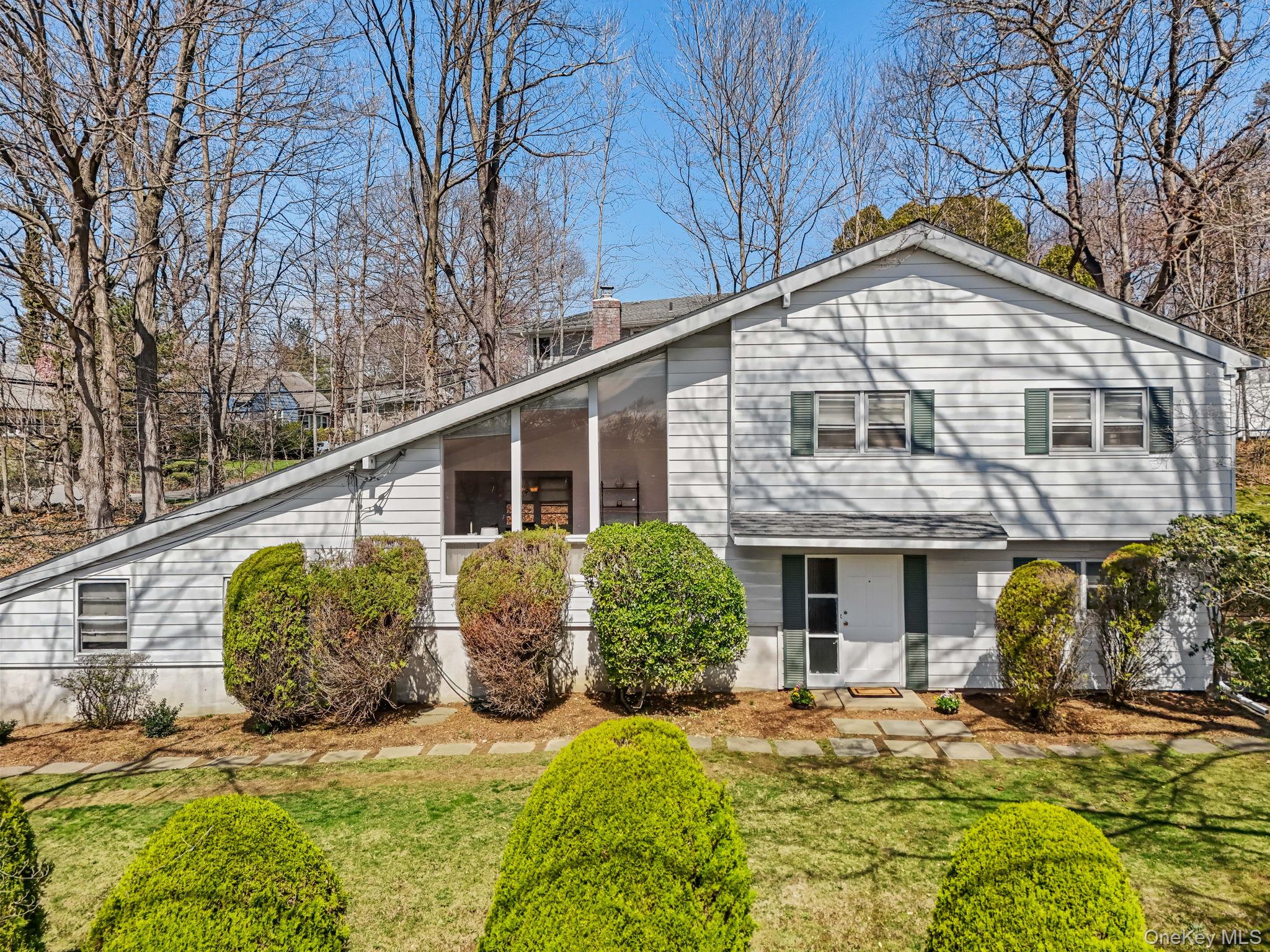 150 Rosedale Avenue White Plains, NY 10605 - Photo 35 of 42 a front view of a house with a garden