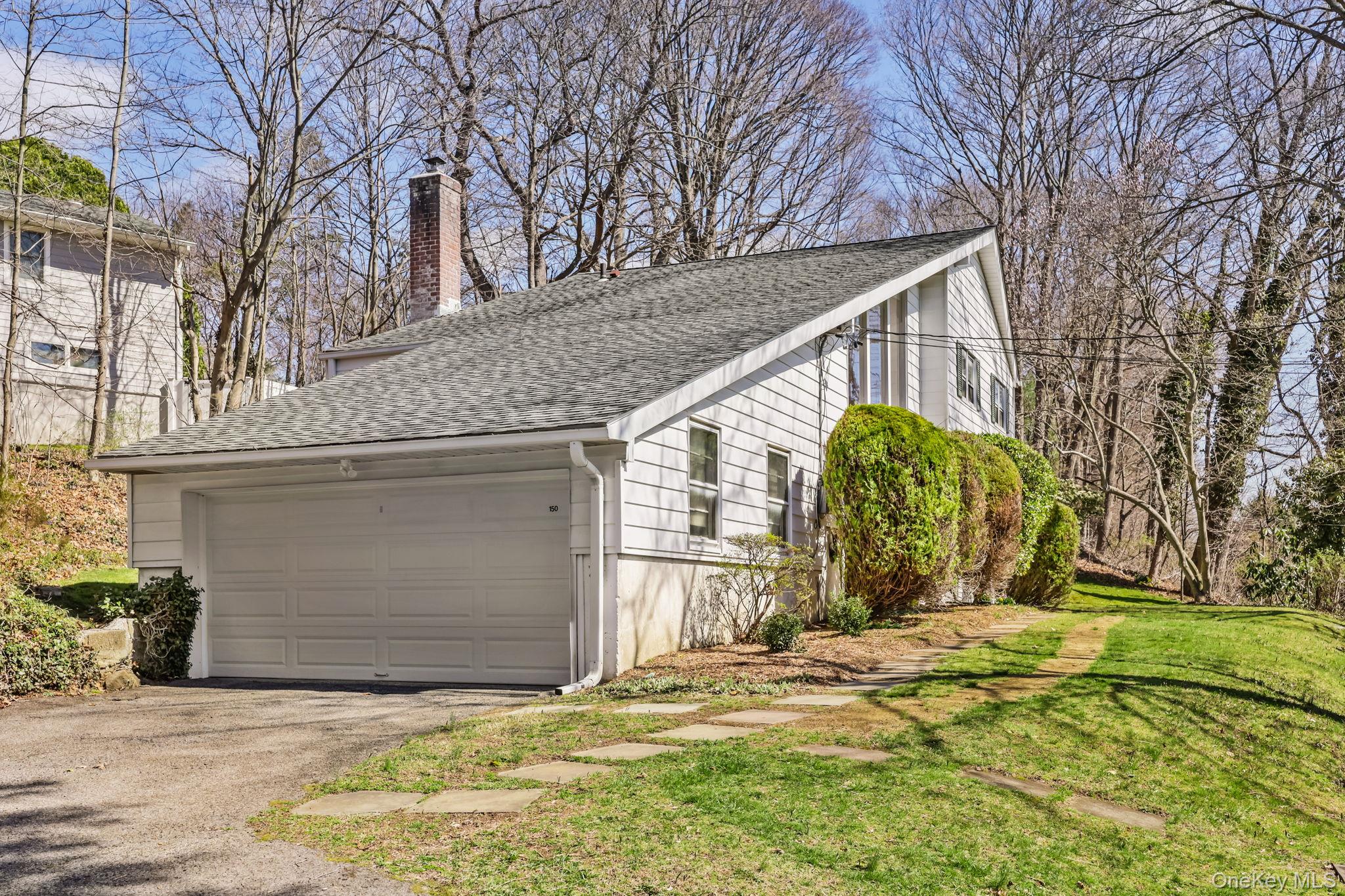 150 Rosedale Avenue White Plains, NY 10605 - Photo 41 of 42 a view of yellow house with a large tree and wooden fence