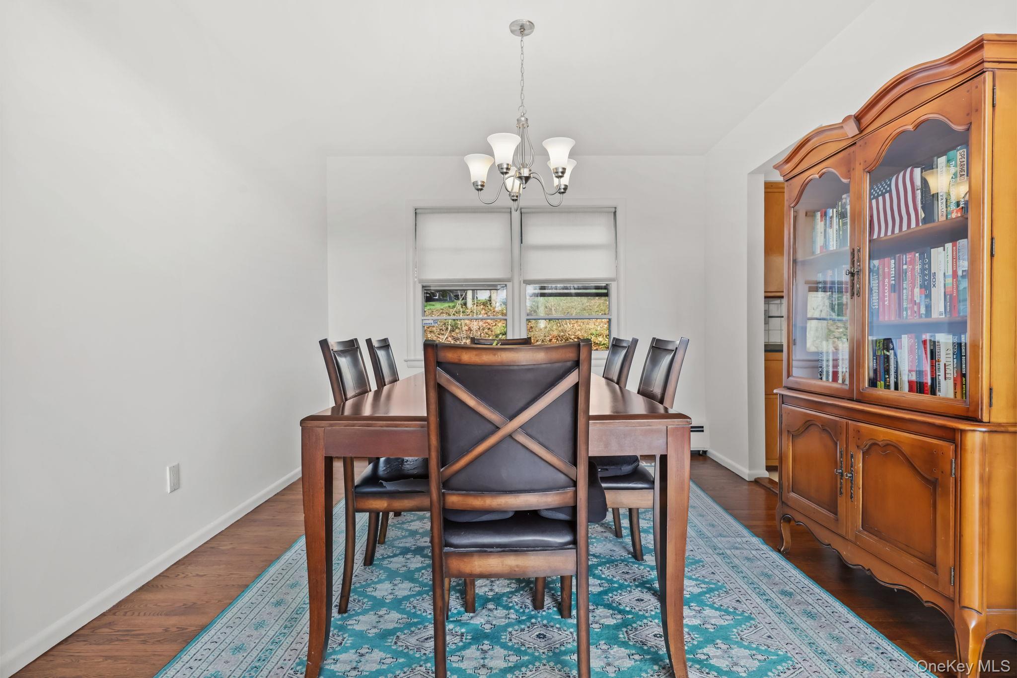 150 Rosedale Avenue White Plains, NY 10605 - Photo 8 of 42 a dining room with furniture a chandelier and wooden floor