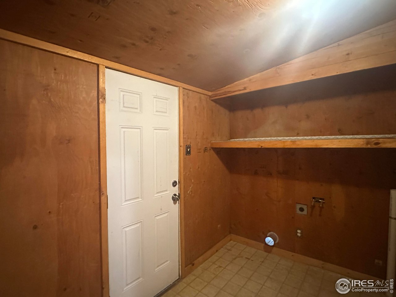 309 Phelps Street Sterling, CO 80751 - Photo 7 of 7 Laundry Room with lots of Storage