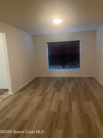 a large bathroom with a granite countertop double vanity sink and a mirror