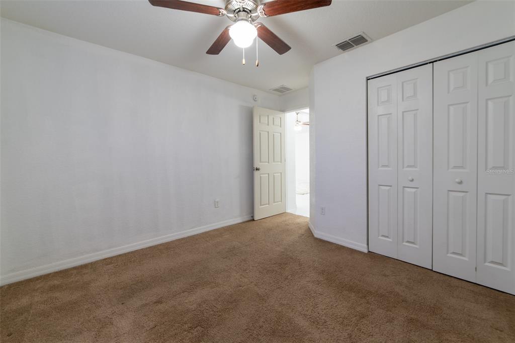 5107 Southwest 165th St Road Ocala, FL 34473 - Photo 27 of 34 a view of an empty room and chandelier fan