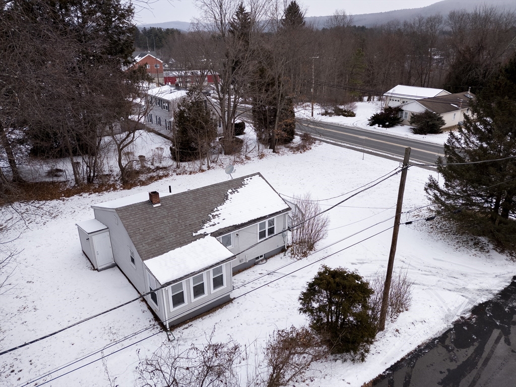 201 West Street Ware, MA 01082 - Photo 18 of 18 a view of a house with a yard covered in snow