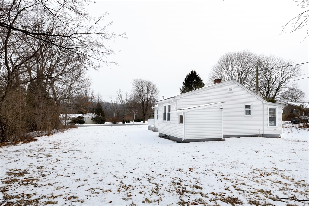 201 West Street Ware, MA 01082 - Photo 4 of 18 a view of white house with snow on the road
