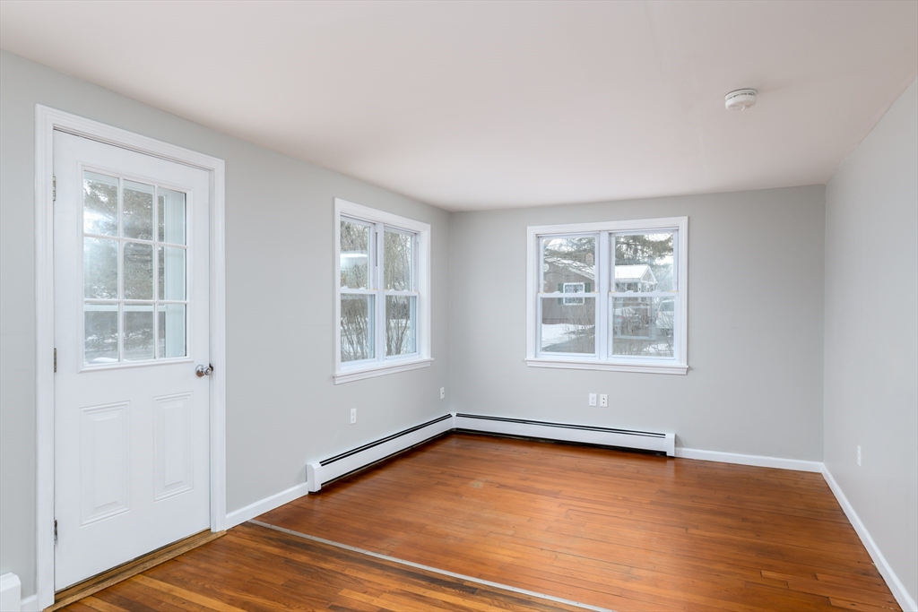 201 West Street Ware, MA 01082 - Photo 5 of 18 an empty room with wooden floor and windows