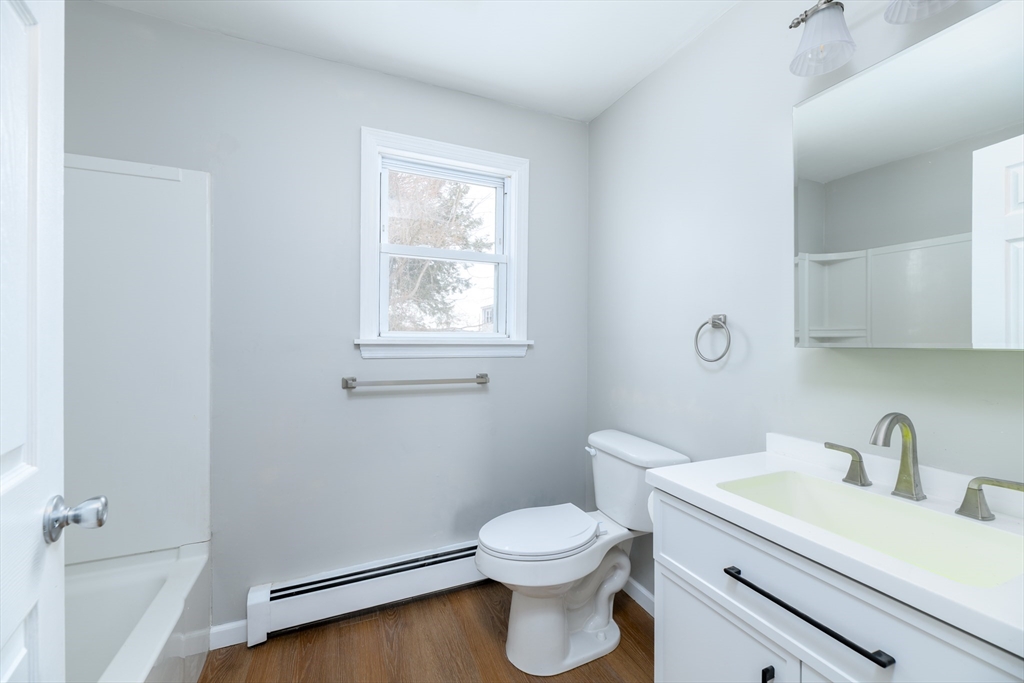 201 West Street Ware, MA 01082 - Photo 7 of 18 a bathroom with a sink a toilet and a window