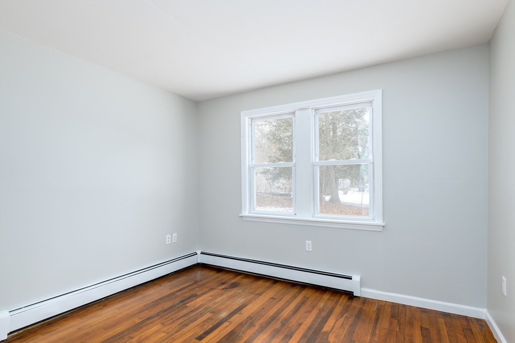 201 West Street Ware, MA 01082 - Photo 8 of 18 an empty room with wooden floor and windows