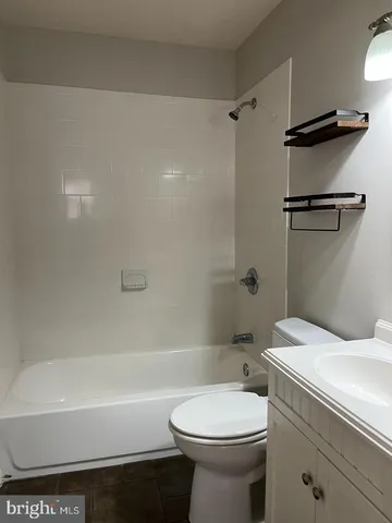 a bathroom with a sink a toilet and a bathtub