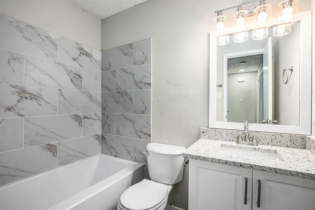 an empty room with a window and wooden floor