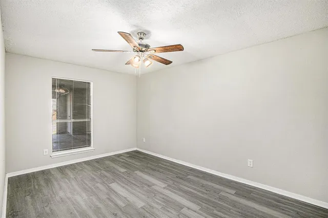 a bathroom with a granite countertop sink toilet and bathtub