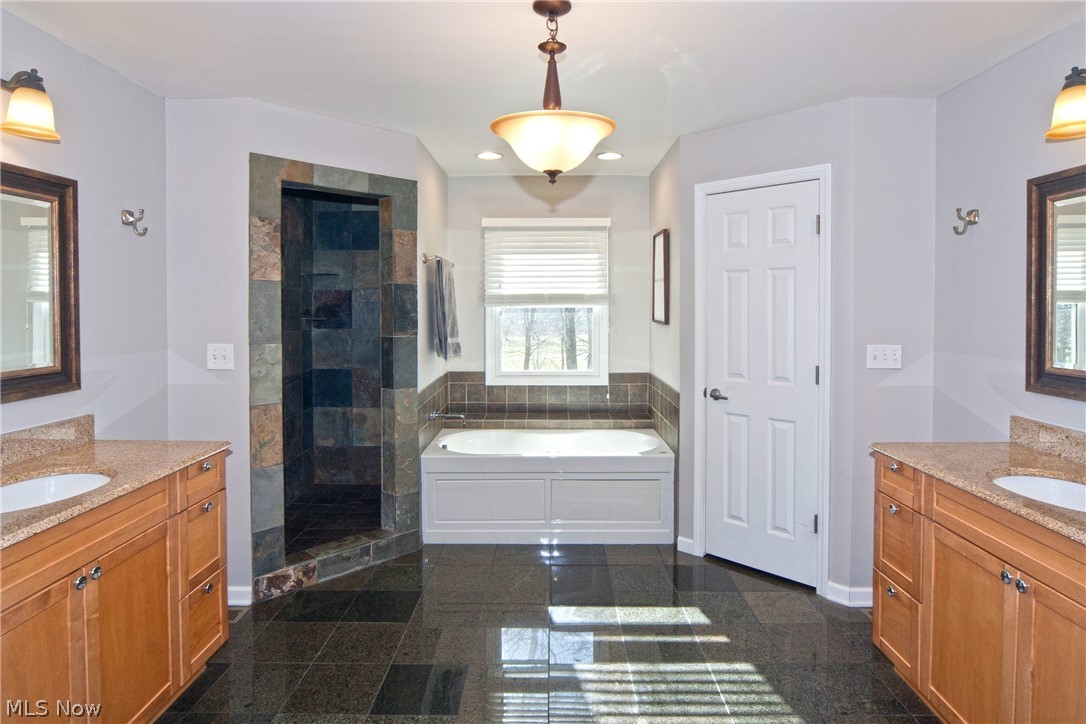 17280 Old State Road Middlefield, OH 44062 - Photo 17 of 24 Master Bath with Separate Vanities, Walk-In Closets, Custom Shower, Jetted Tub & Tile Floor