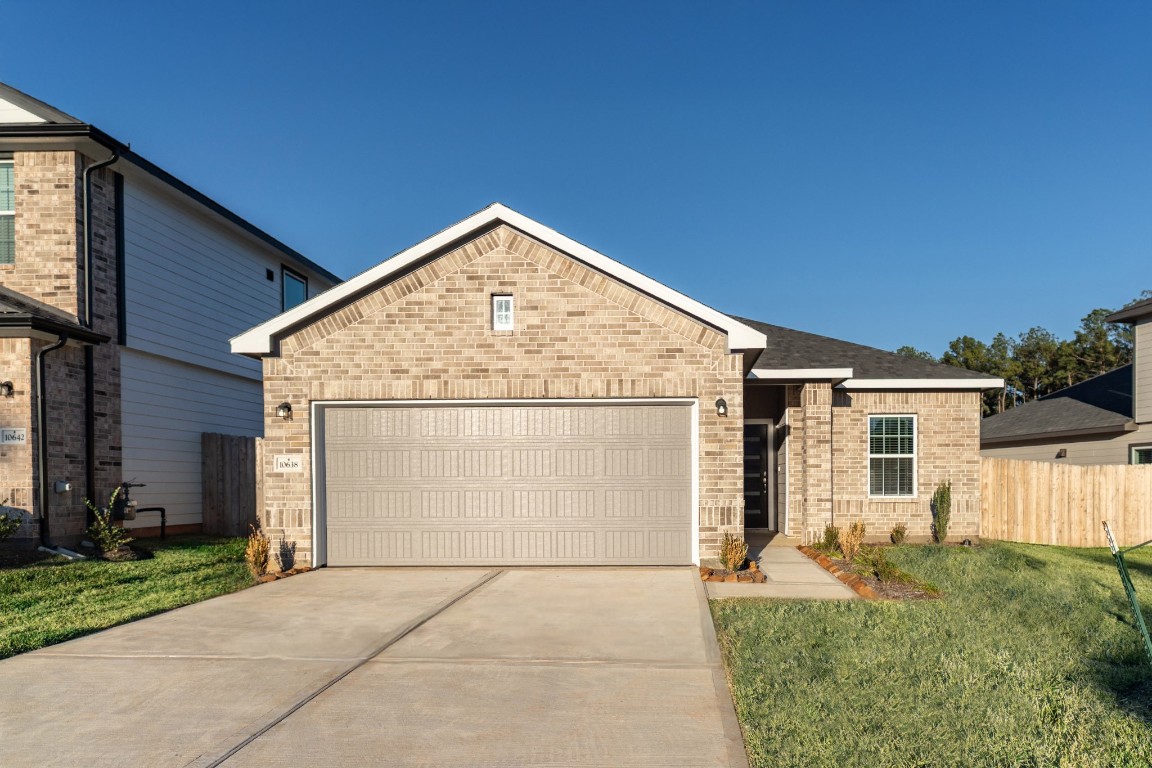10638 Altitude Way Conroe, TX 77303 - Photo 1 of 29 a view of house with backyard