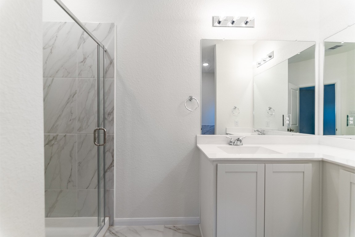 10638 Altitude Way Conroe, TX 77303 - Photo 18 of 29 a bathroom with a sink and mirror