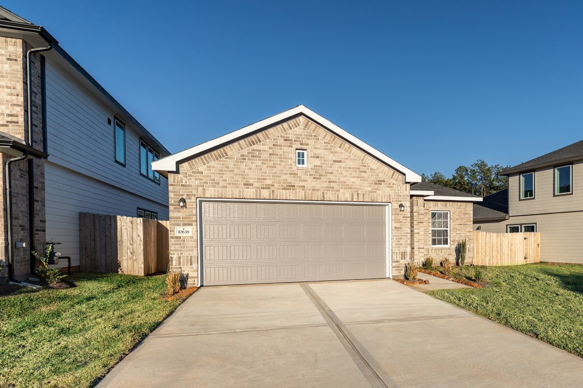 10638 Altitude Way Conroe, TX 77303 - Photo 2 of 29 a view of a house with a backyard