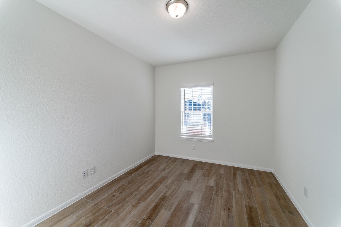 10638 Altitude Way Conroe, TX 77303 - Photo 4 of 29 a view of a room that has wooden floor and window