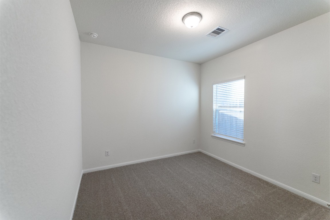 10638 Altitude Way Conroe, TX 77303 - Photo 6 of 29 an empty room with a window