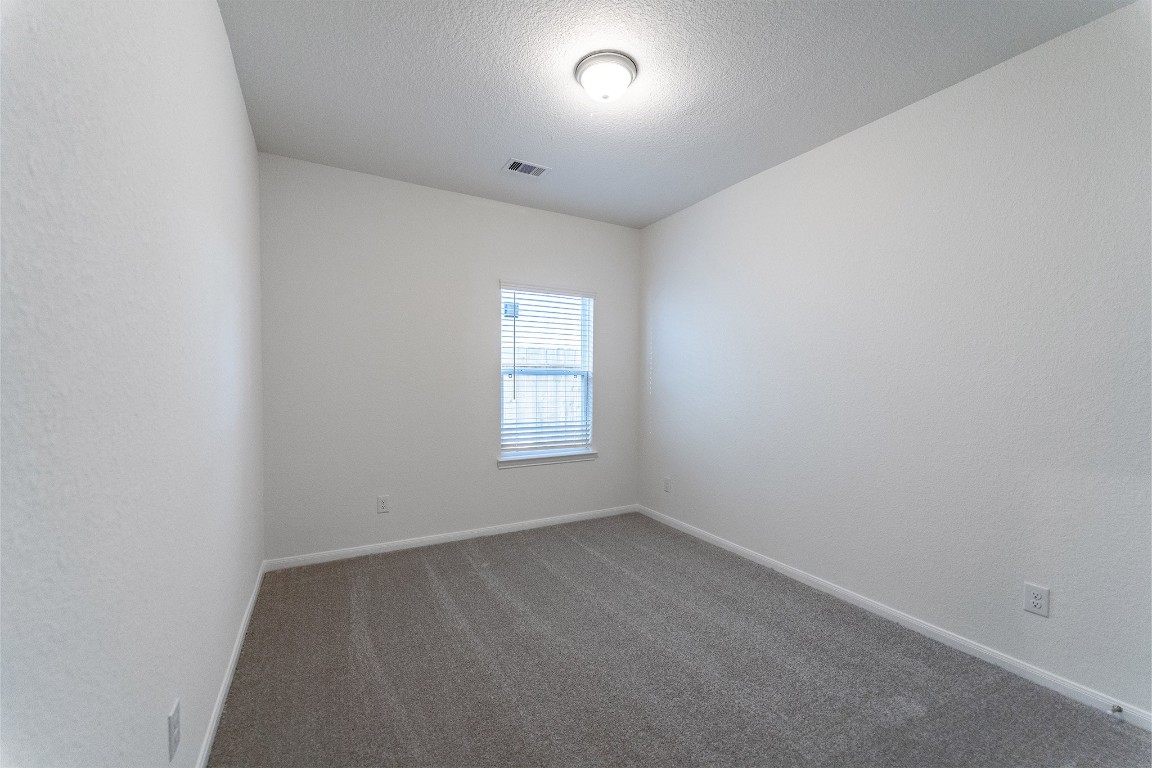10638 Altitude Way Conroe, TX 77303 - Photo 7 of 29 an empty room with a window