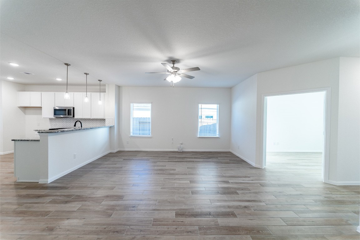 10638 Altitude Way Conroe, TX 77303 - Photo 9 of 29 a view of an empty room with kitchen appliances and a window
