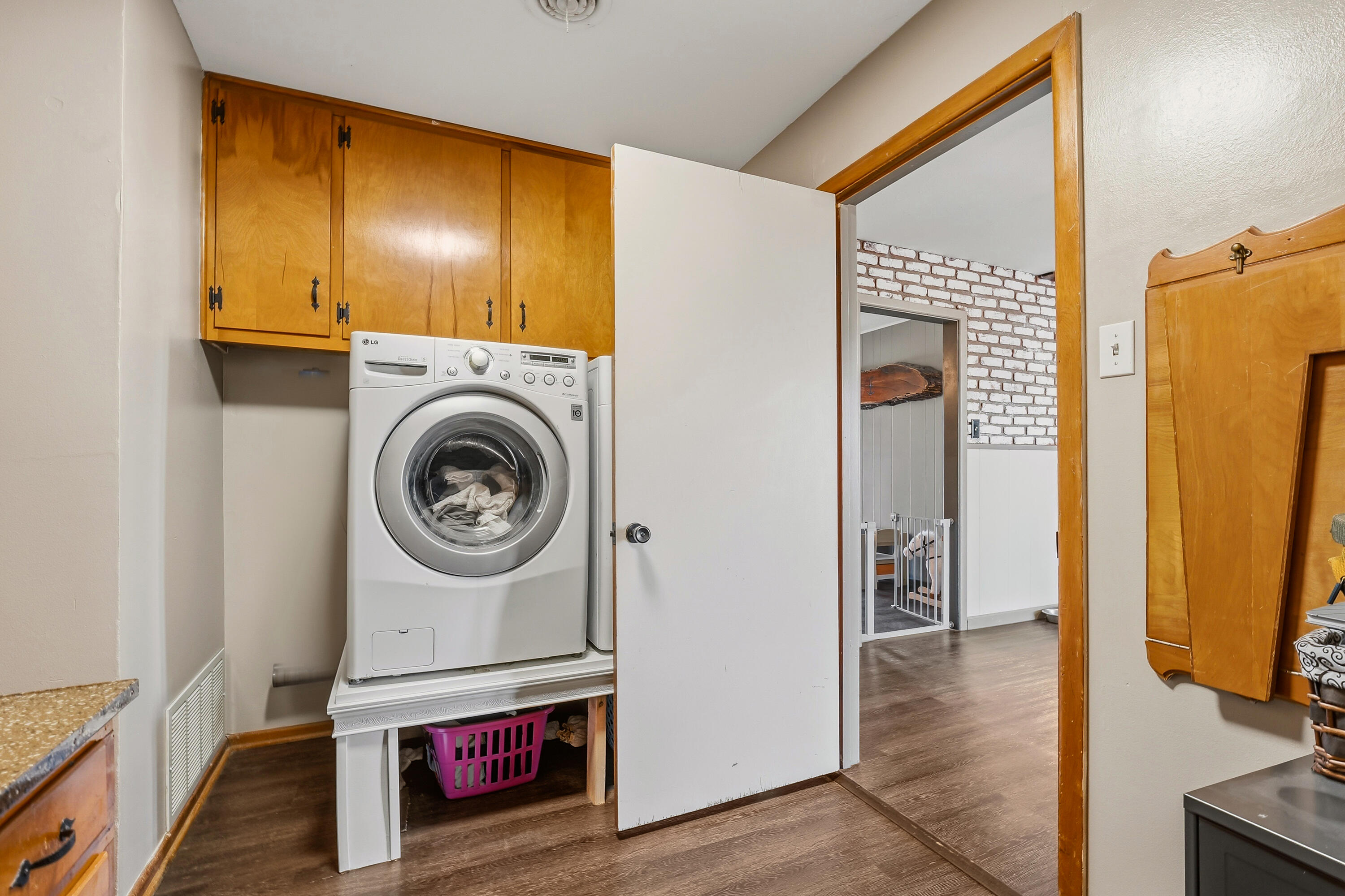 707 12th Street Shallowater, TX 79363 - Photo 13 of 27 a view of a hallway with washer and dryer