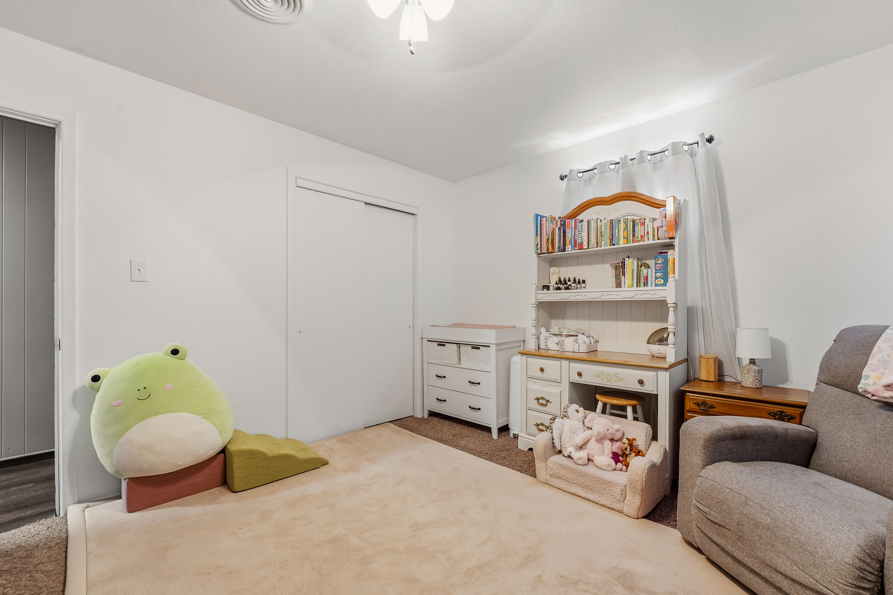 707 12th Street Shallowater, TX 79363 - Photo 15 of 27 a room with furniture and a wooden floor
