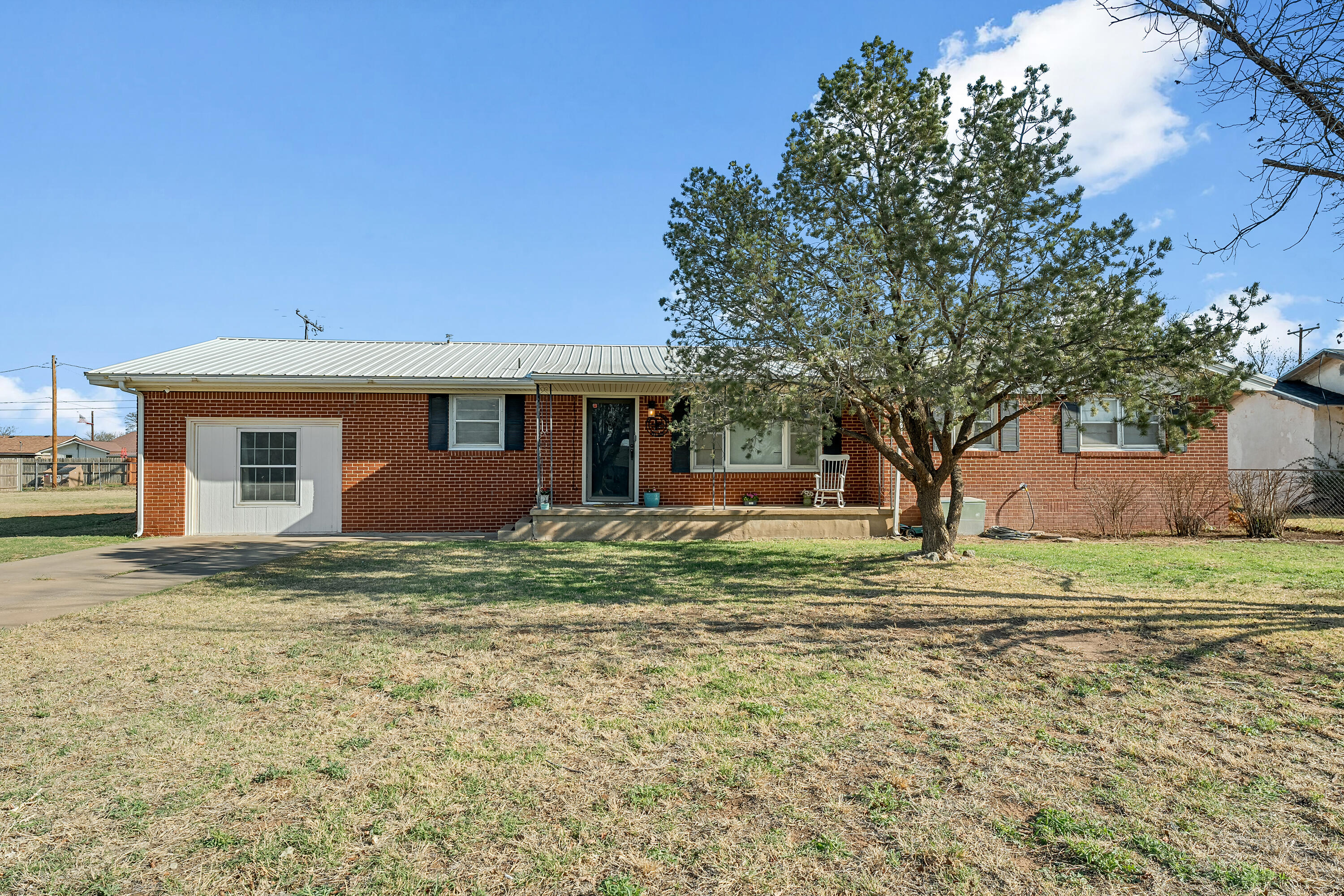 707 12th Street Shallowater, TX 79363 - Photo 2 of 27 a view of a house with a yard