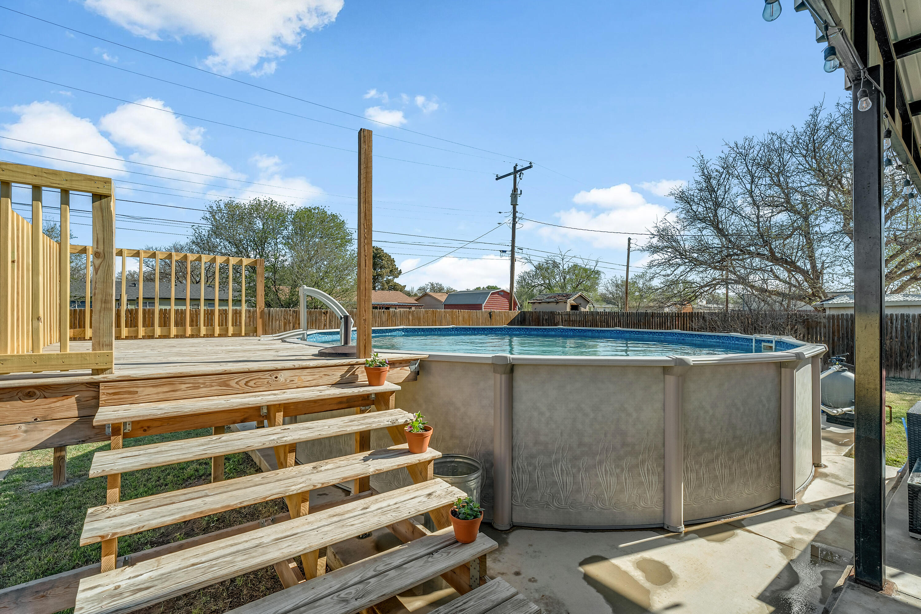 707 12th Street Shallowater, TX 79363 - Photo 24 of 27 a view of balcony with wooden floor and fence