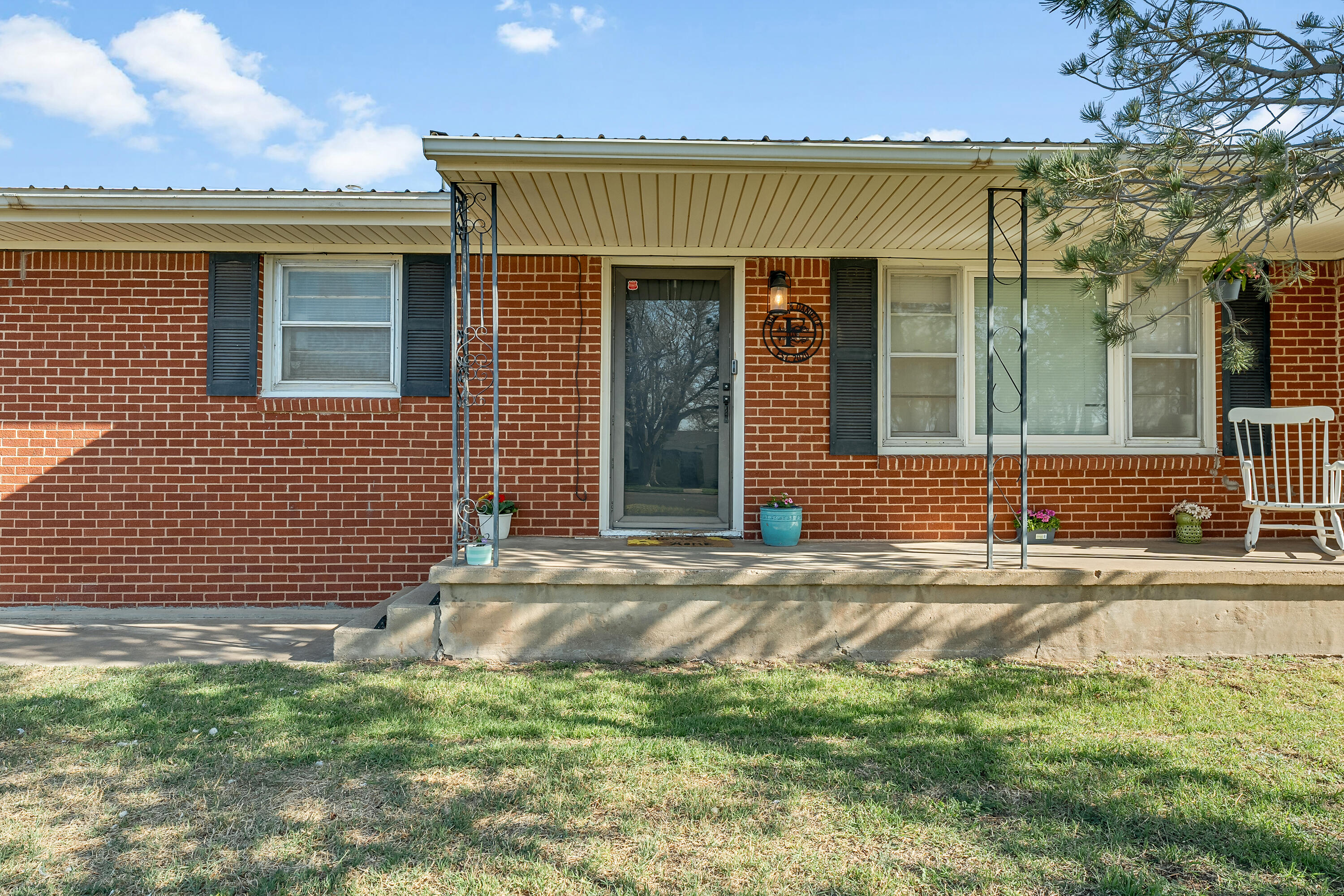 707 12th Street Shallowater, TX 79363 - Photo 3 of 27 a view of a house with a yard and large parking space
