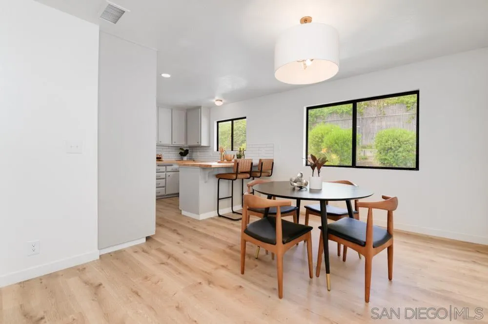 4635 Briar Ridge Road Oceanside, CA 92056 - Photo 11 of 23 a view of a dining room with furniture and a window