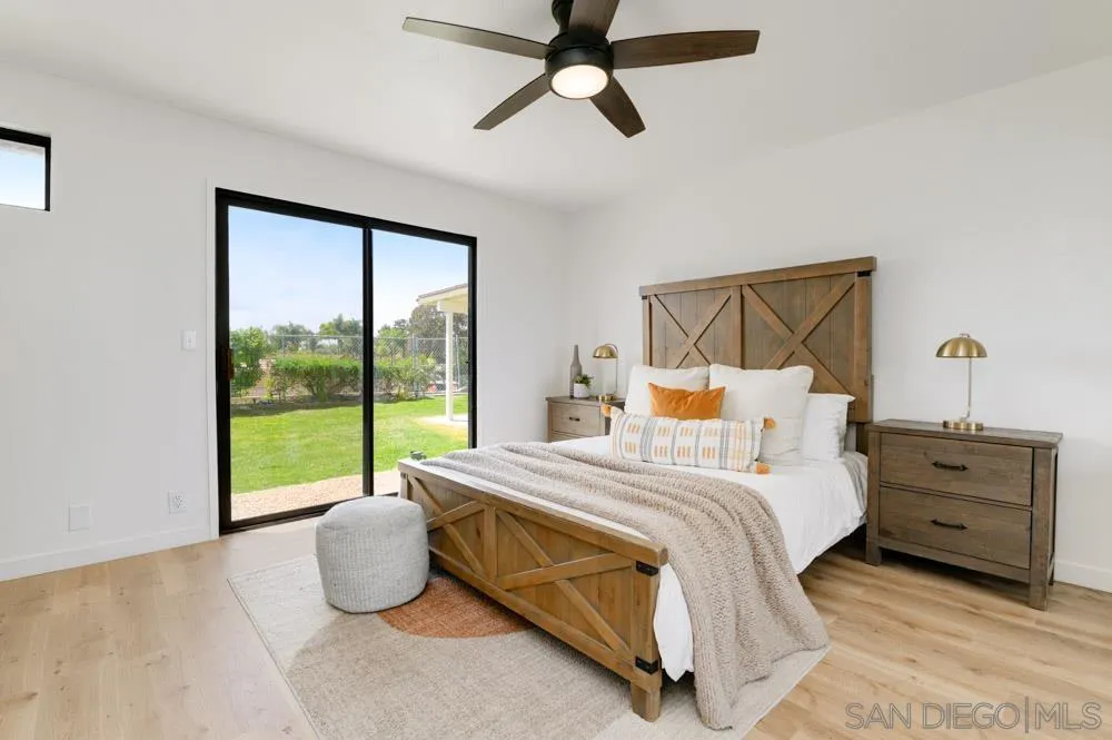 4635 Briar Ridge Road Oceanside, CA 92056 - Photo 12 of 23 a bed sitting in a bedroom next to a window