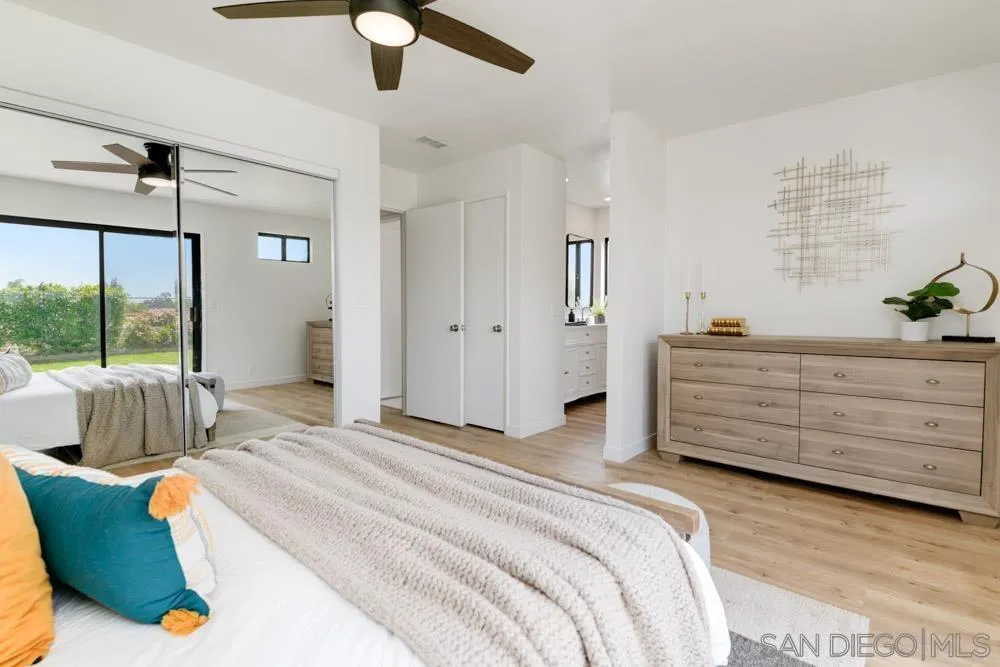 4635 Briar Ridge Road Oceanside, CA 92056 - Photo 14 of 23 a bedroom with a bed and a dresser