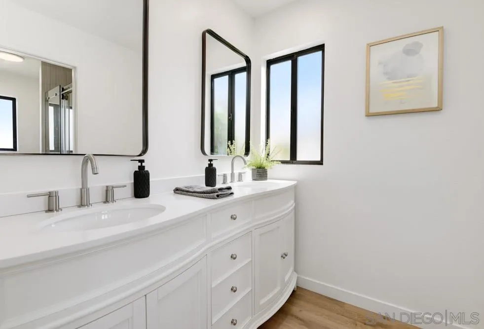 4635 Briar Ridge Road Oceanside, CA 92056 - Photo 16 of 23 a bathroom with double vanity sink and two mirror