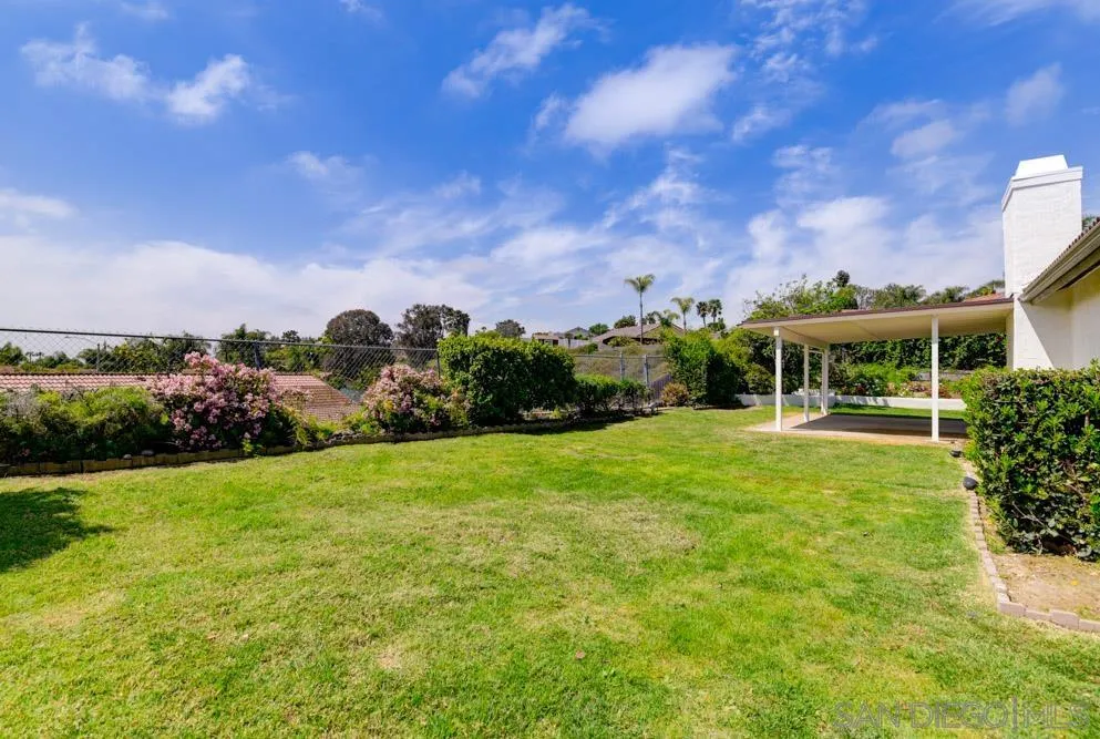 4635 Briar Ridge Road Oceanside, CA 92056 - Photo 21 of 23 a front view of a house with a yard
