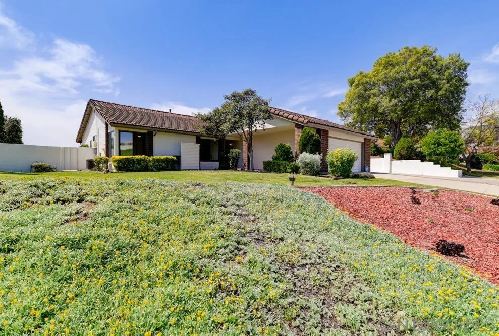 4635 Briar Ridge Road Oceanside, CA 92056 - Photo 23 of 23 a front view of a house with a yard