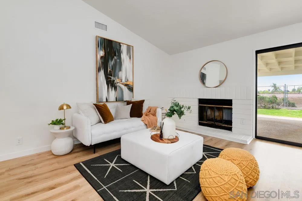 4635 Briar Ridge Road Oceanside, CA 92056 - Photo 6 of 23 a living room with furniture and a fireplace