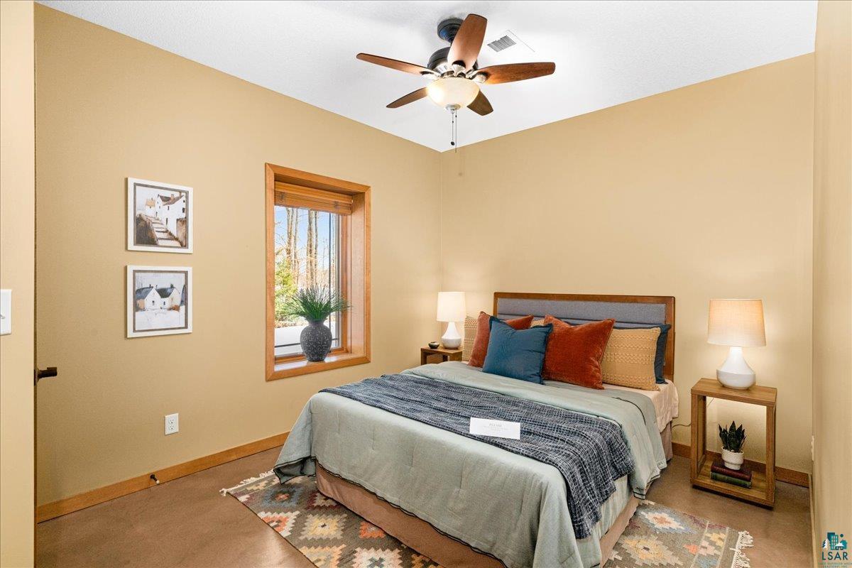 92598 Spells Road Sturgeon Lake, MN 55783 - Photo 31 of 60 Carpeted bedroom featuring baseboards and ceiling fan
