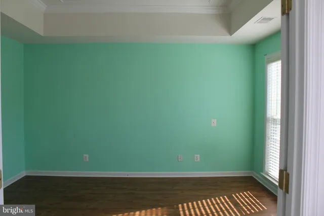 a view of a small space with wooden floor