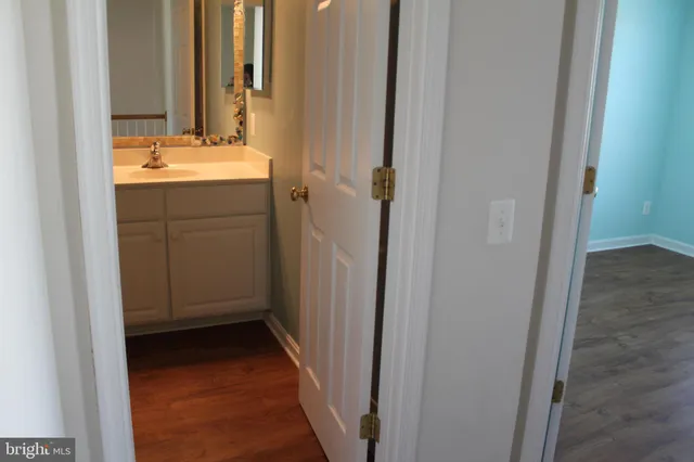 a bathroom with a sink and mirror
