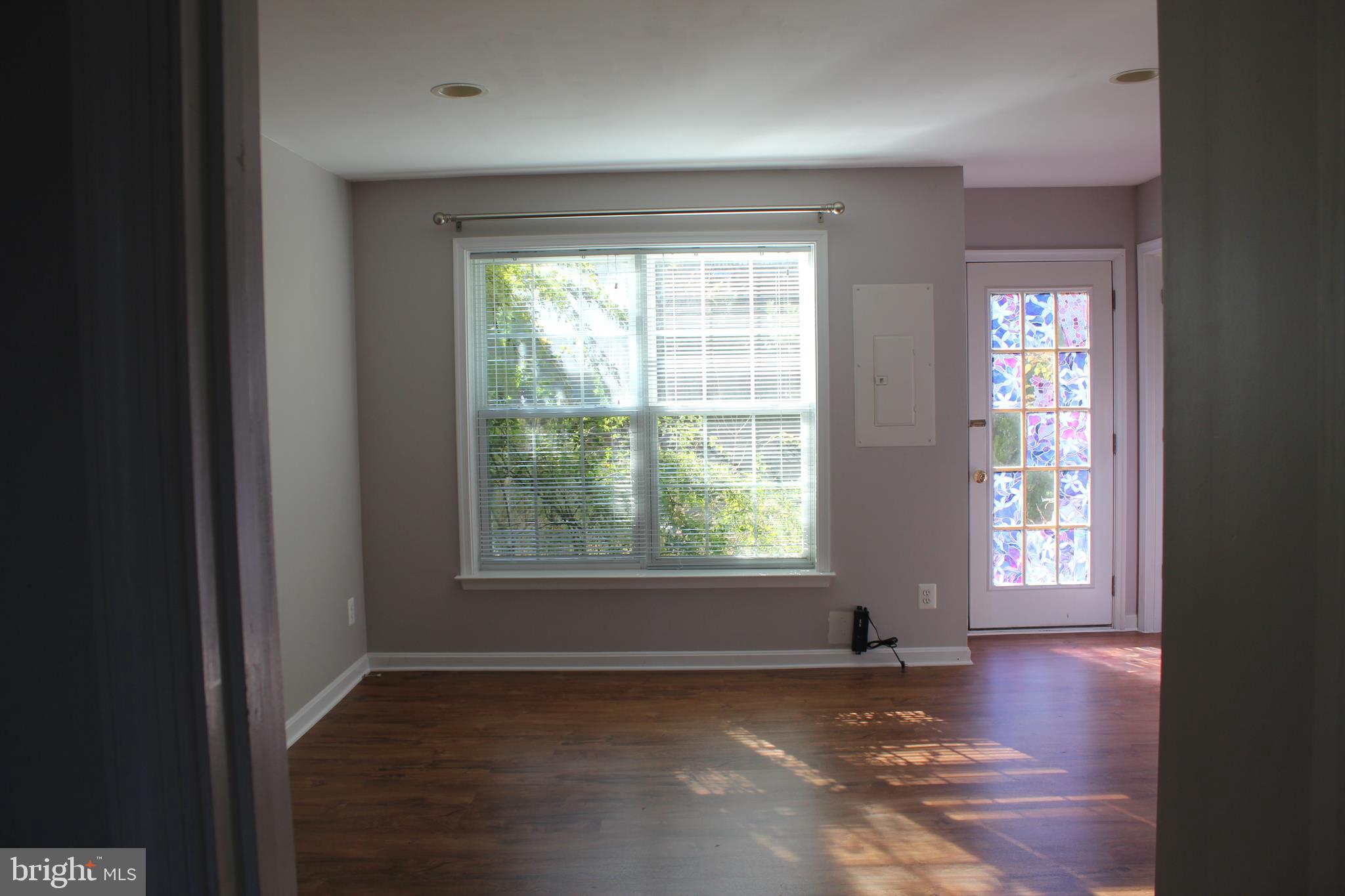 13507 Stargazer Terrace Centreville, VA 20120 - Photo 23 of 25 an empty room with wooden floor and windows