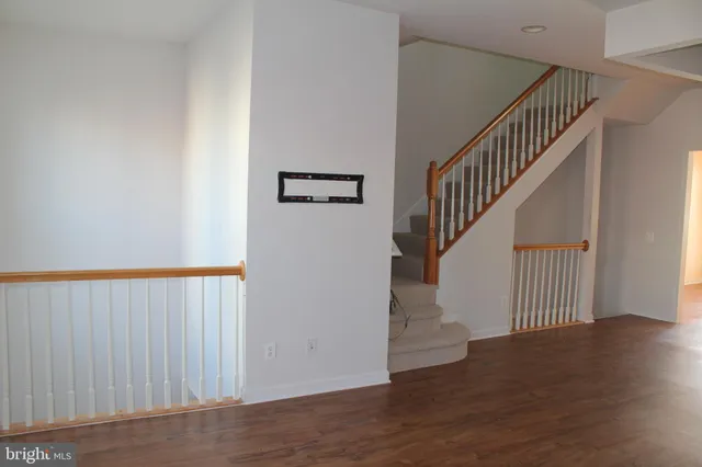 a view of entryway with wooden floor