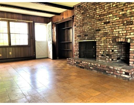 37 Crestwood Road Marblehead, MA 01945 - Photo 11 of 26 a view of an empty room with a fireplace and a window