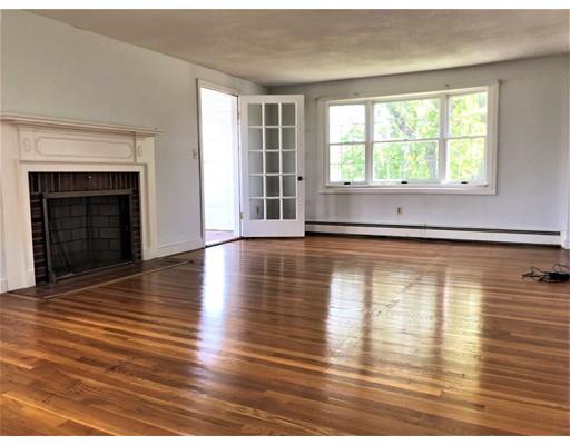 37 Crestwood Road Marblehead, MA 01945 - Photo 3 of 26 an empty room with wooden floor and a fireplace