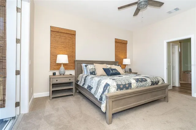 a bathroom with a granite countertop sink a mirror a vanity and shower