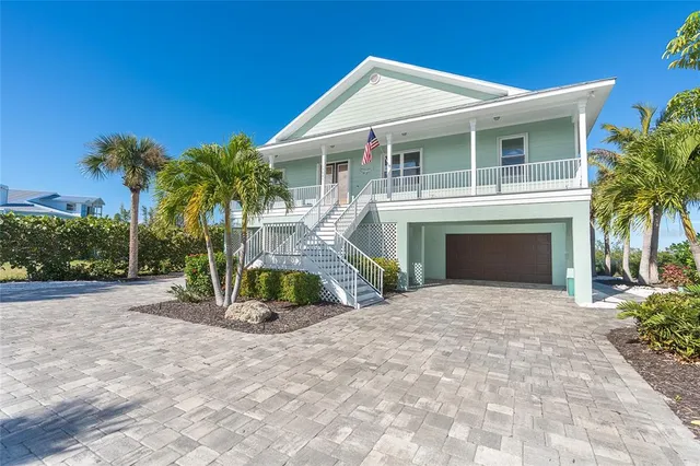 a view of a house with potted plants